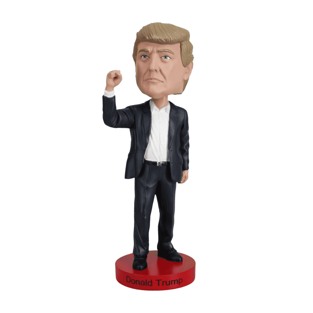 Miniatura bobblehead de Donald Trump em traje social sobre base vermelha